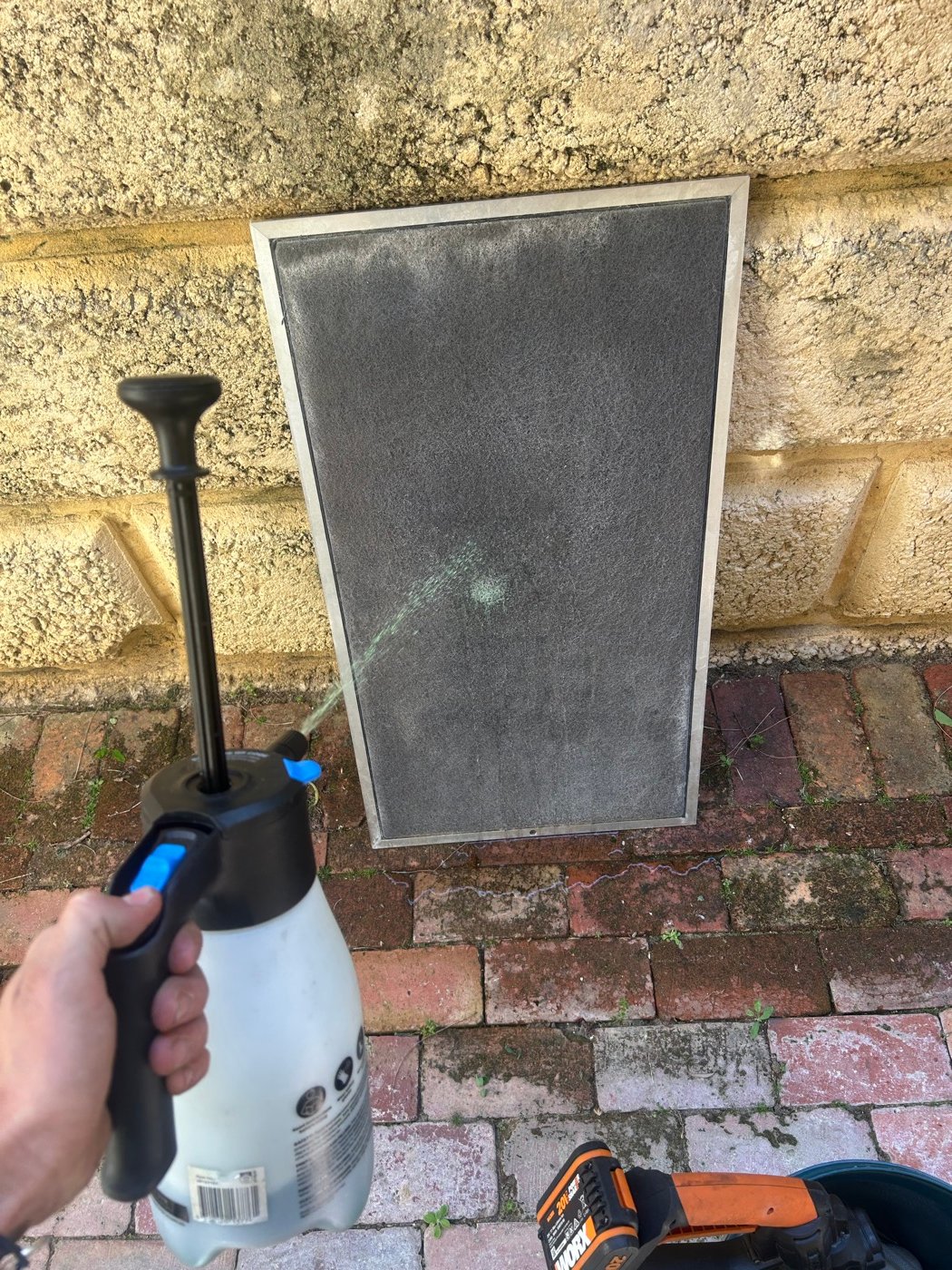 Ducted air conditioning return air filter being cleaned